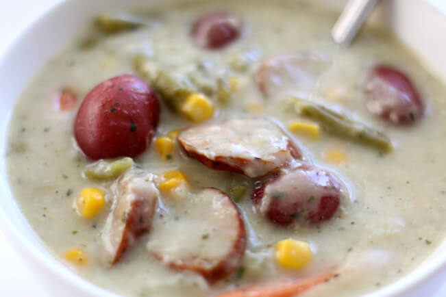 Instant Pot Garlic Parmesan Sausage Chowder--a colorful and flavorful summer chowder with garlic, smoked sausage, parmesan cheese, corn, potatoes, green beans and carrots. Your whole family will love this soup!