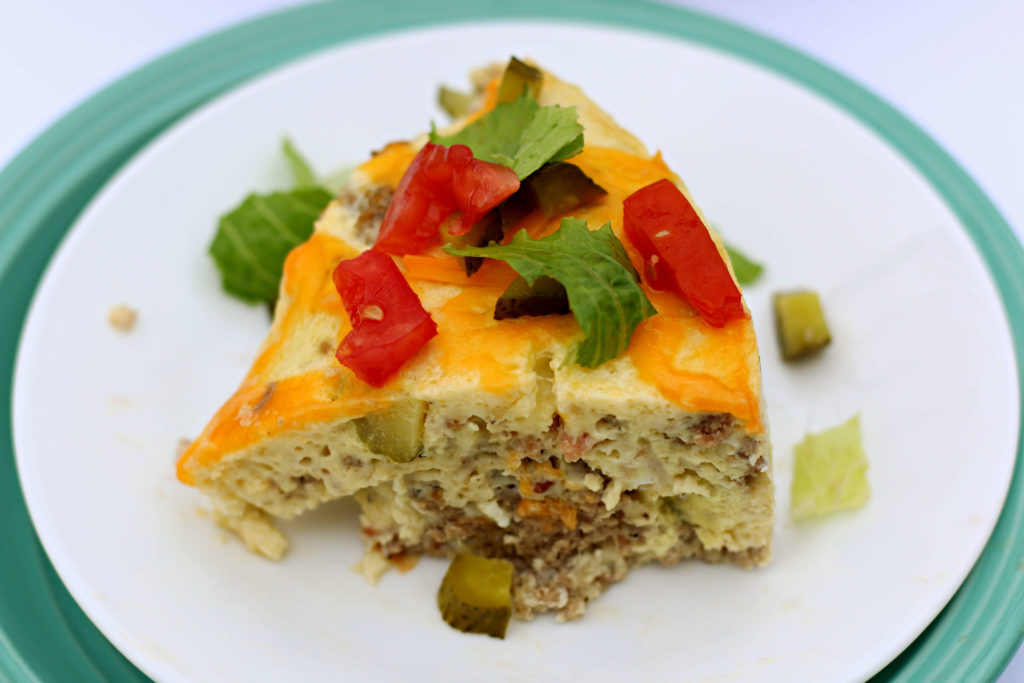 Instant Pot Cheeseburger Breakfast Casserole--a low carb egg dish that has bacon, beef, cheddar and pickles. This easy quiche-like dish is perfect for breakfast or dinner. It reminds of the Starbucks egg bites. 