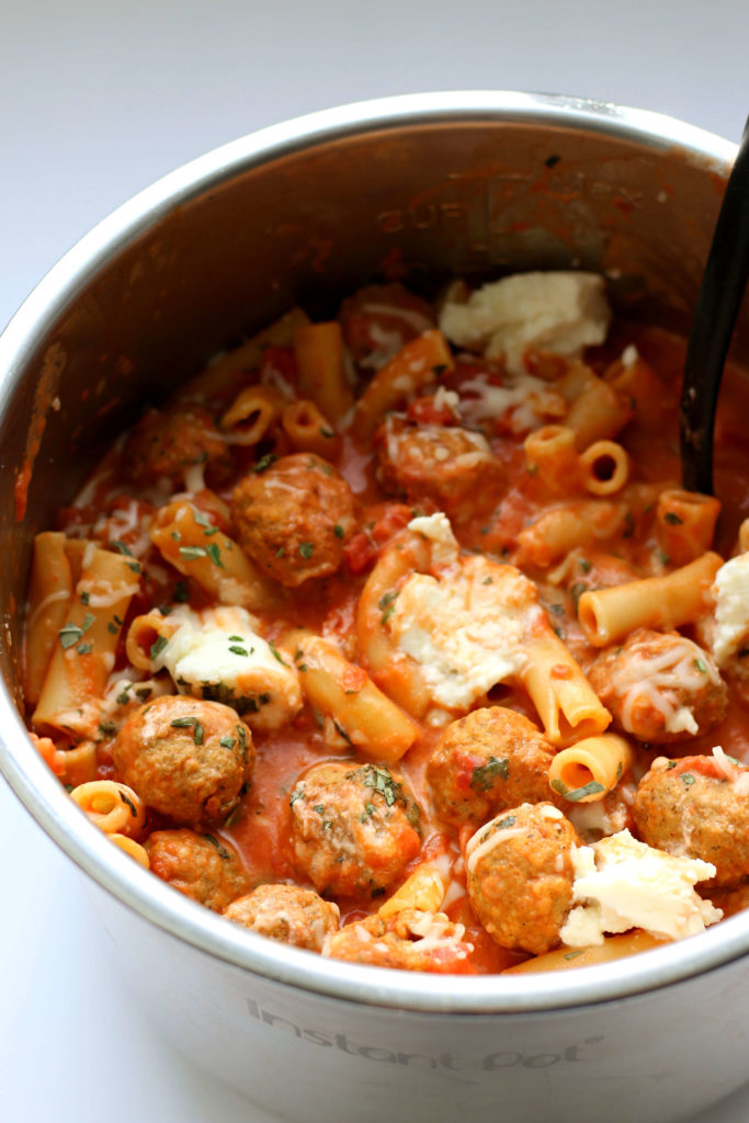 Instant Pot Ziti and Meatballs--an easy Instant Pot version of baked ziti with a scrumptious tomato cream sauce, ricotta and meatballs. Everyone will be asking for seconds! 