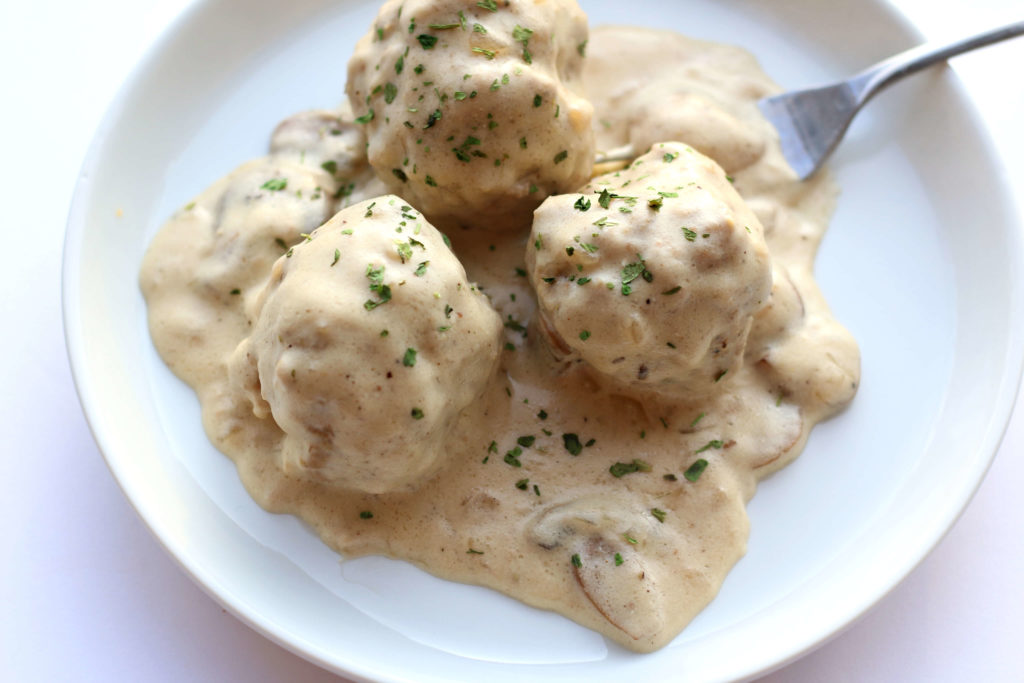 Slow Cooker Polish Meatballs with Sour Cream Mushroom Sauce--a creamy delectable mushroom sauce covers well seasoned and tender meatballs. 