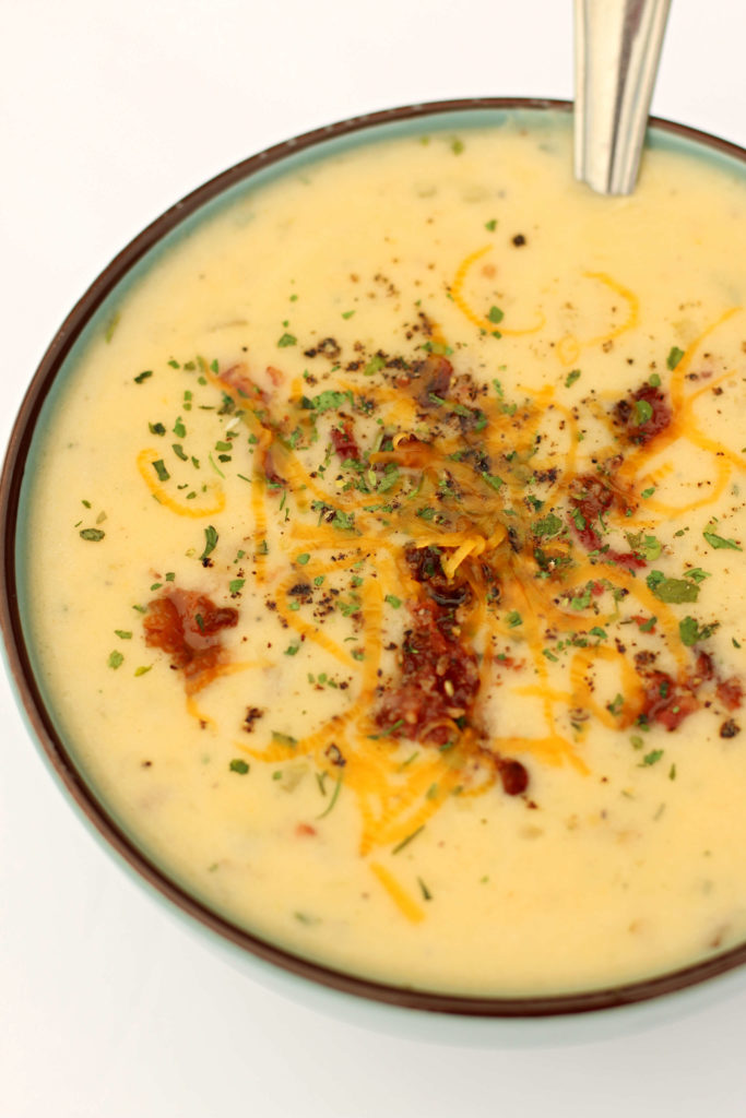 Slow Cooker Marie Callender's Potato Cheese Soup--a simple but delicious cheesy potato soup that you can make at home in your slow cooker! Similar to the recipe for potato cheese soup that you can order at Marie Callender's.
