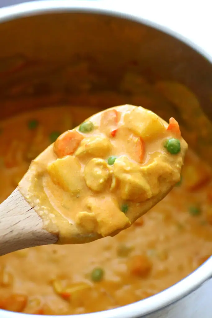 Instant Pot Chicken Veggie Korma--a rich and creamy mild curry-like dish  with tender bites of chicken and vegetables. 