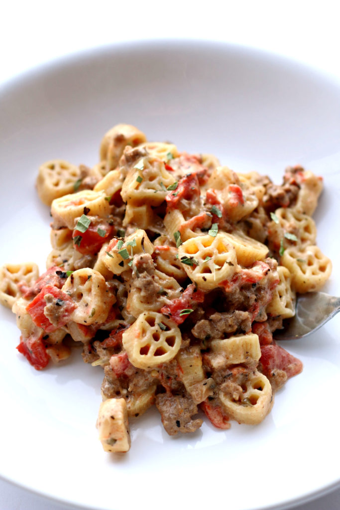 Instant Pot Pioneer Pasta--wagon wheel pasta and ground beef are cooked with fire roasted tomatoes, seasonings, cream cheese and pepper jack cheese for a pasta dish that has tons of flavor. Kids and adults love this meal!
