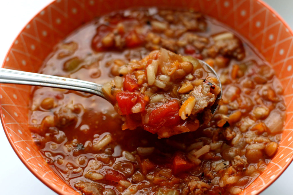 Instant Pot Sausage Lentil Rice Soup--a flavorful hearty soup with chunks of sausage, lentils, rice, fire roasted tomatoes and seasonings. Give it a shot for dinner this week! 