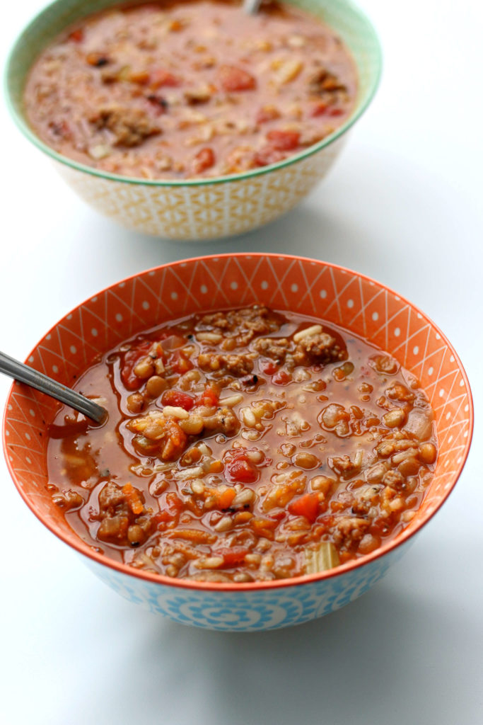 Slow Cooker Sausage Lentil Rice Soup--a flavorful hearty soup with chunks of sausage, lentils, rice, fire roasted tomatoes and seasonings. Give it a shot for dinner this week! 