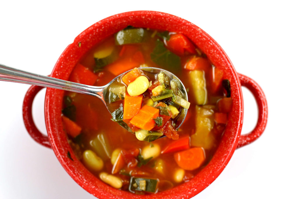 red bowl with vegetable soup