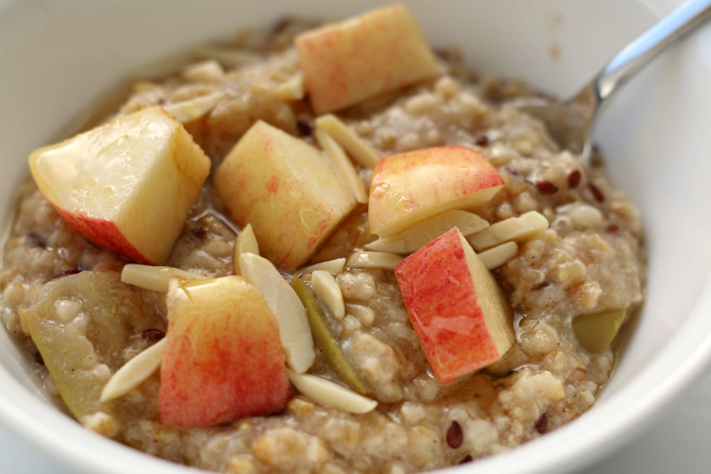 bowl of oatmeal with apples
