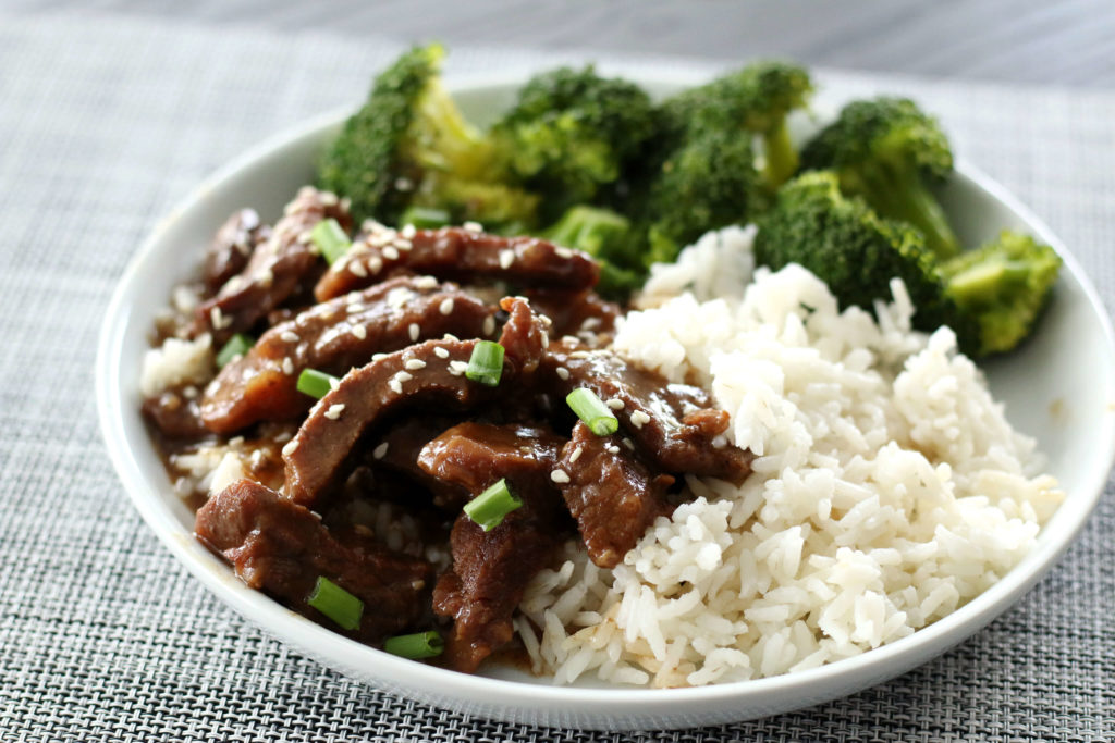 beef rice and broccoli on a plate