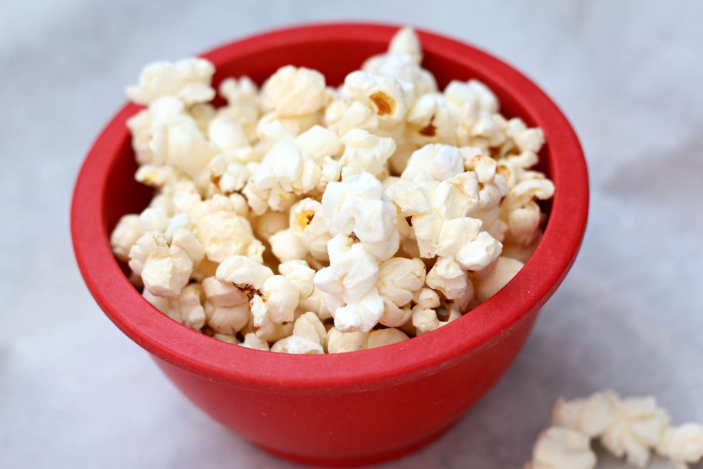 popcorn in a red bowl