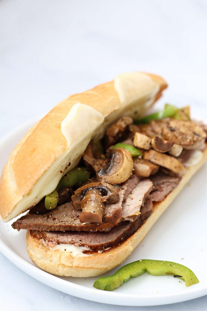 eye of round roast cooked in the instant pot sandwich with peppers and onions and mushrooms