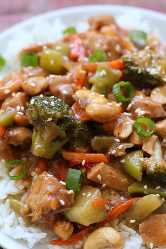 Instant Pot Honey Cashew Chicken--chicken, sauce, vegetables and cashews all made in one pot! It's sweet with a little heat and a perfect dump-and-go weeknight meal.