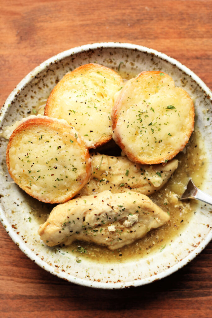french onion chicken with baguette slices