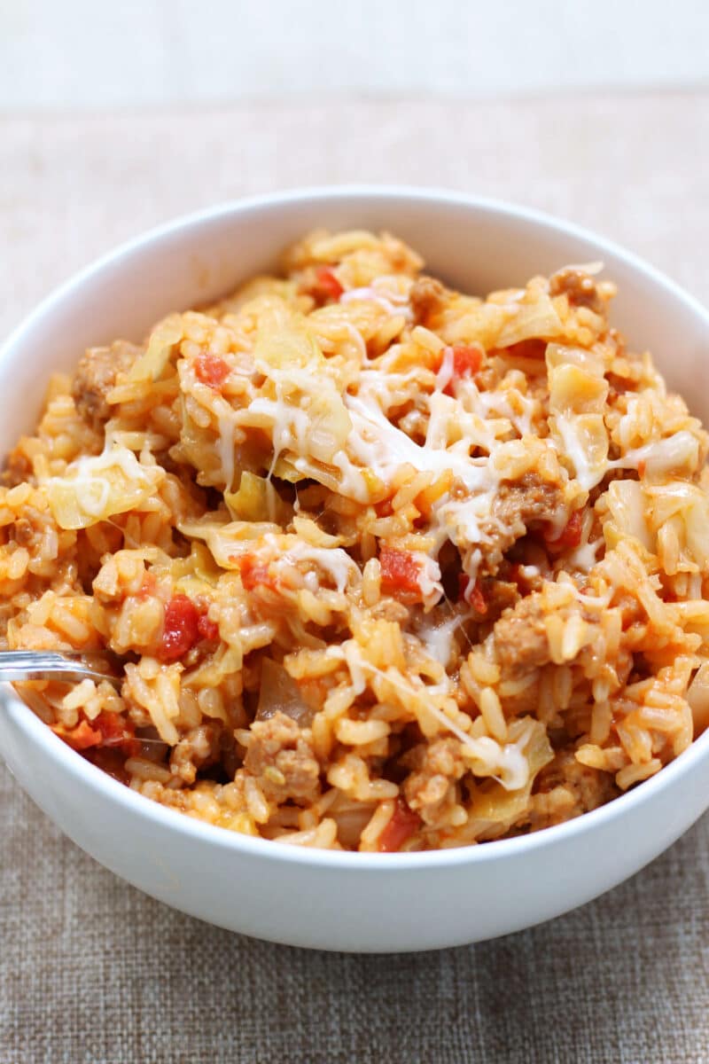 Easy One Pot Dirty Cabbage Casserole--an easy one-pot dinner made with Italian sausage, tender cabbage, fire-roasted tomatoes, rice and melty mozzarella cheese.