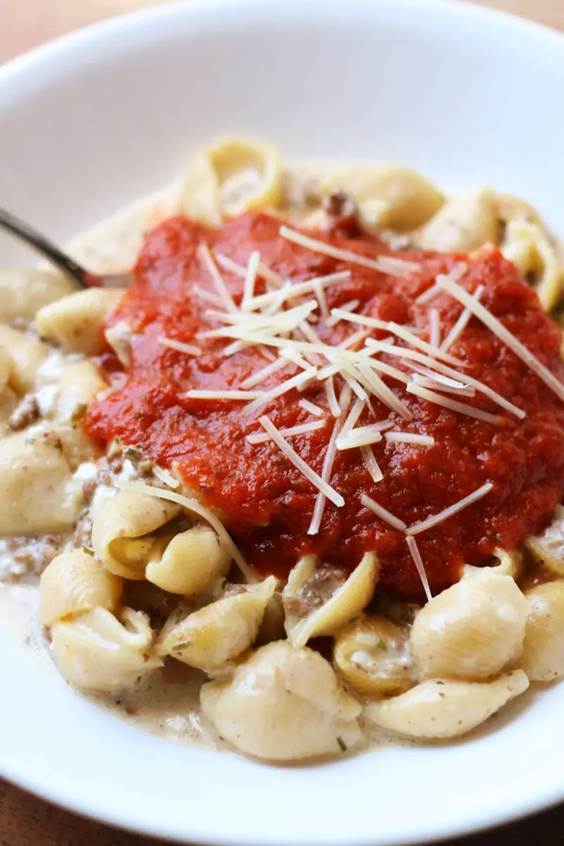 Classic Amish Hamburger Casserole--an easy Instant Pot pasta dinner with seasoned ground beef, tender pasta shells, creamy cheese and pizza sauce for a meal that's ready in about 30 minutes.