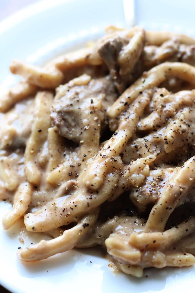 Crockpot French Onion Beef and Noodles--tender beef, sweet caramelized onions, frozen egg noodles, and a creamy French onion-inspired sauce in the slow cooker or Instant Pot.