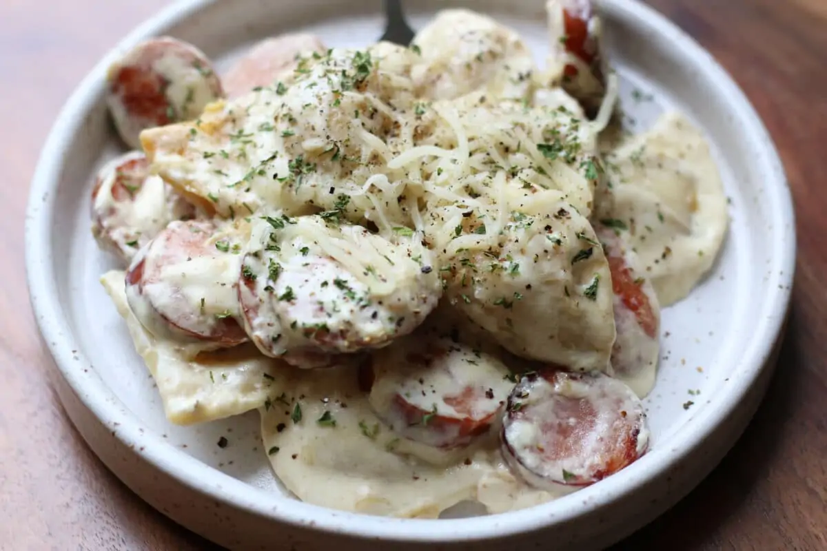 Crockpot Pierogi Summer Sausage Casserole--a creamy sausage and pierogi skillet or crockpot recipe is an easy comfort food dinner the whole family will love.
