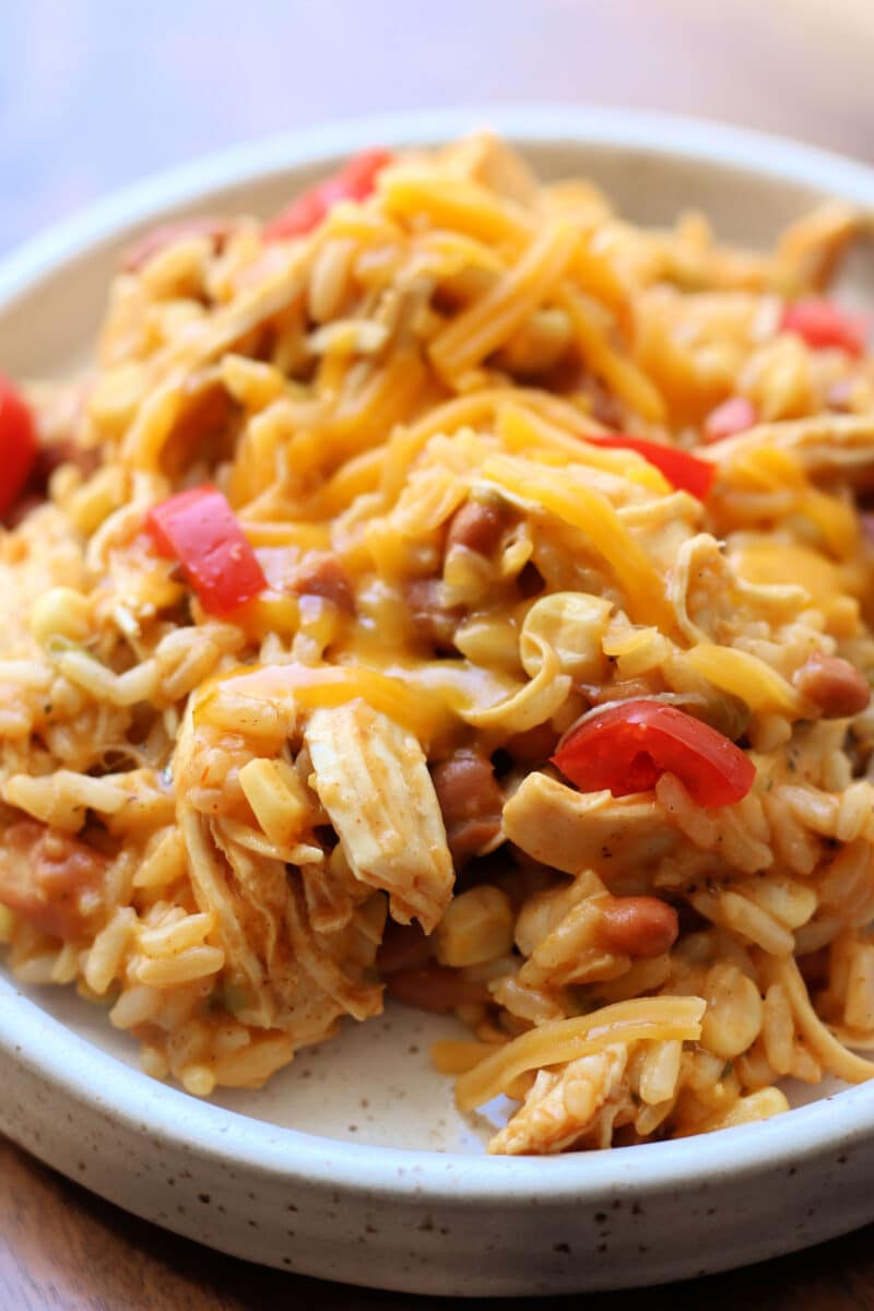 Western Cowgirl Casserole--an Instant Pot dinner made with tender chicken, ranch seasoning, rice, ranch style beans, green chiles, and corn for an easy one pot meal.
