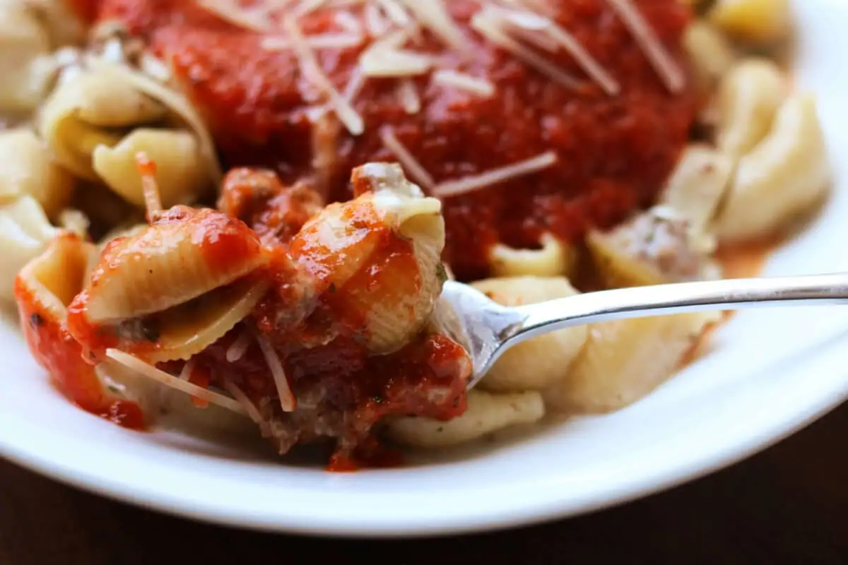 Classic Amish Hamburger Casserole--an easy Instant Pot pasta dinner with seasoned ground beef, tender pasta shells, creamy cheese and pizza sauce for a meal that's ready in about 30 minutes.