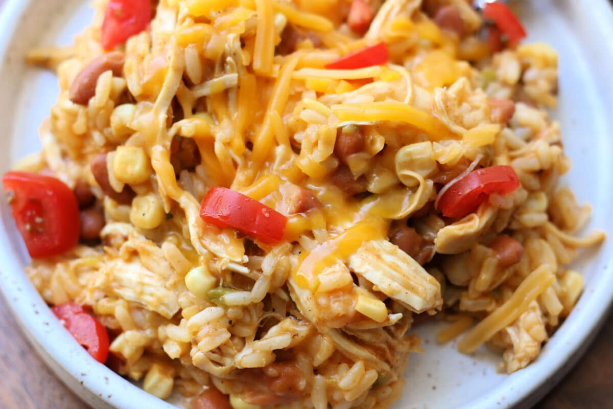 Western Cowgirl Casserole--an Instant Pot dinner made with tender chicken, ranch seasoning, rice, ranch style beans, green chiles, and corn for an easy one pot meal.