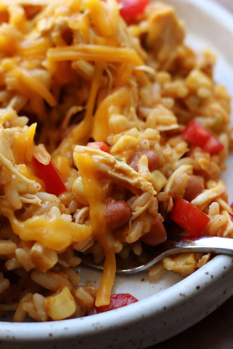 Western Cowgirl Casserole--an Instant Pot dinner made with tender chicken, ranch seasoning, rice, ranch style beans, green chiles, and corn for an easy one pot meal.