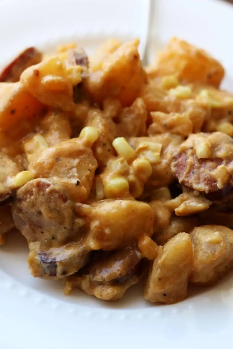 Kielbasa Sausage Cheesy Potato Casserole--an Instant Pot or slow cooker dinner made with smoked sausage, tender potatoes, sweet corn, cheddar cheese, and a creamy sauce.