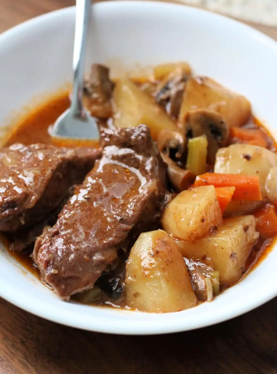 Montana Slow Cooker Roast--a crockpot meal meal loaded with juicy beef, carrots, potatoes, mushrooms, and a delicious homemade gravy.