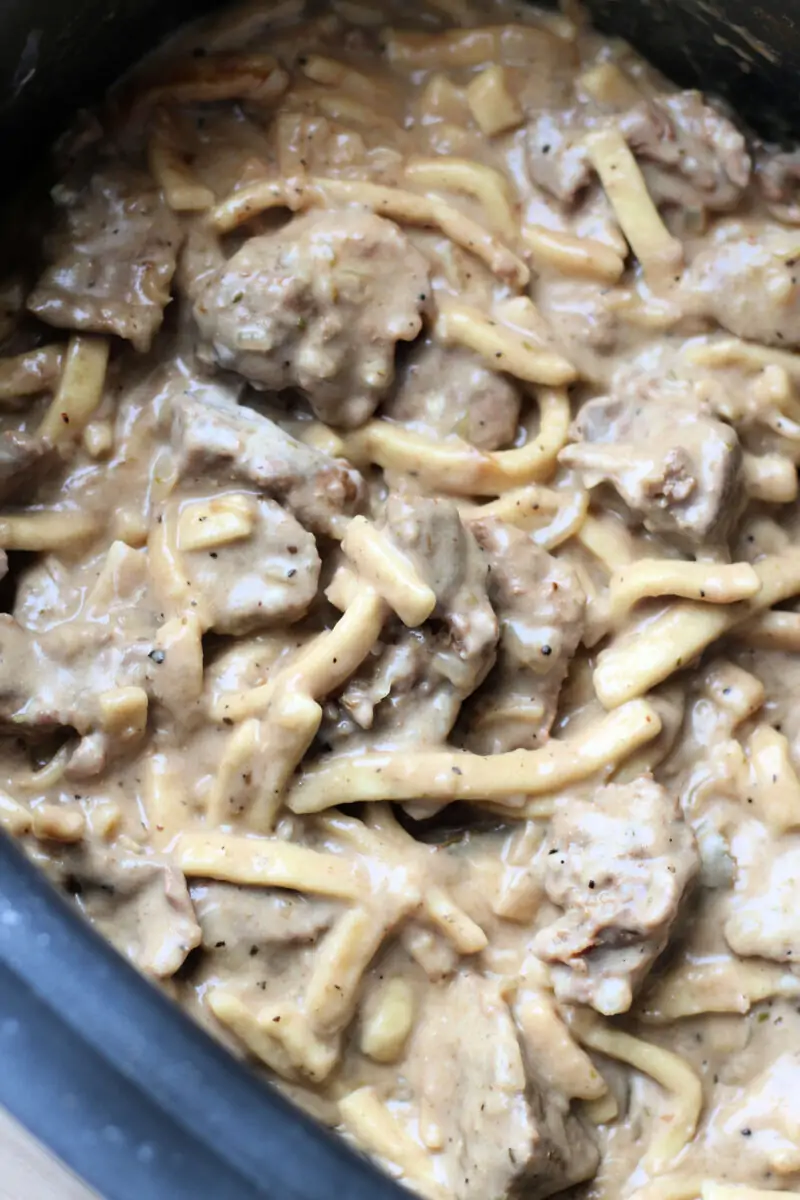 Crockpot French Onion Beef and Noodles--tender beef, sweet caramelized onions, frozen egg noodles, and a creamy French onion-inspired sauce in the slow cooker or Instant Pot.