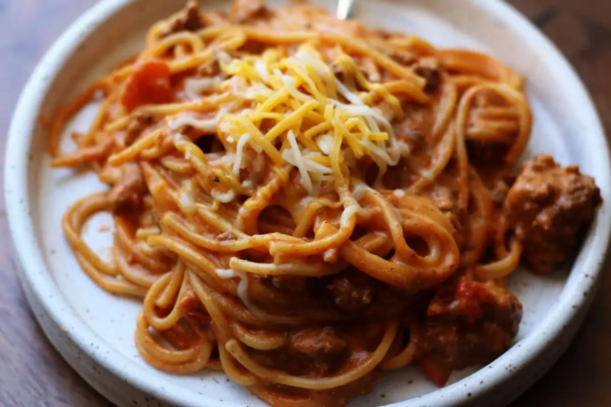 Million Dollar Taco Pasta--an easy Instant Pot dinner made with ground beef, spaghetti, taco seasoning, Rotel and melty cheese.
