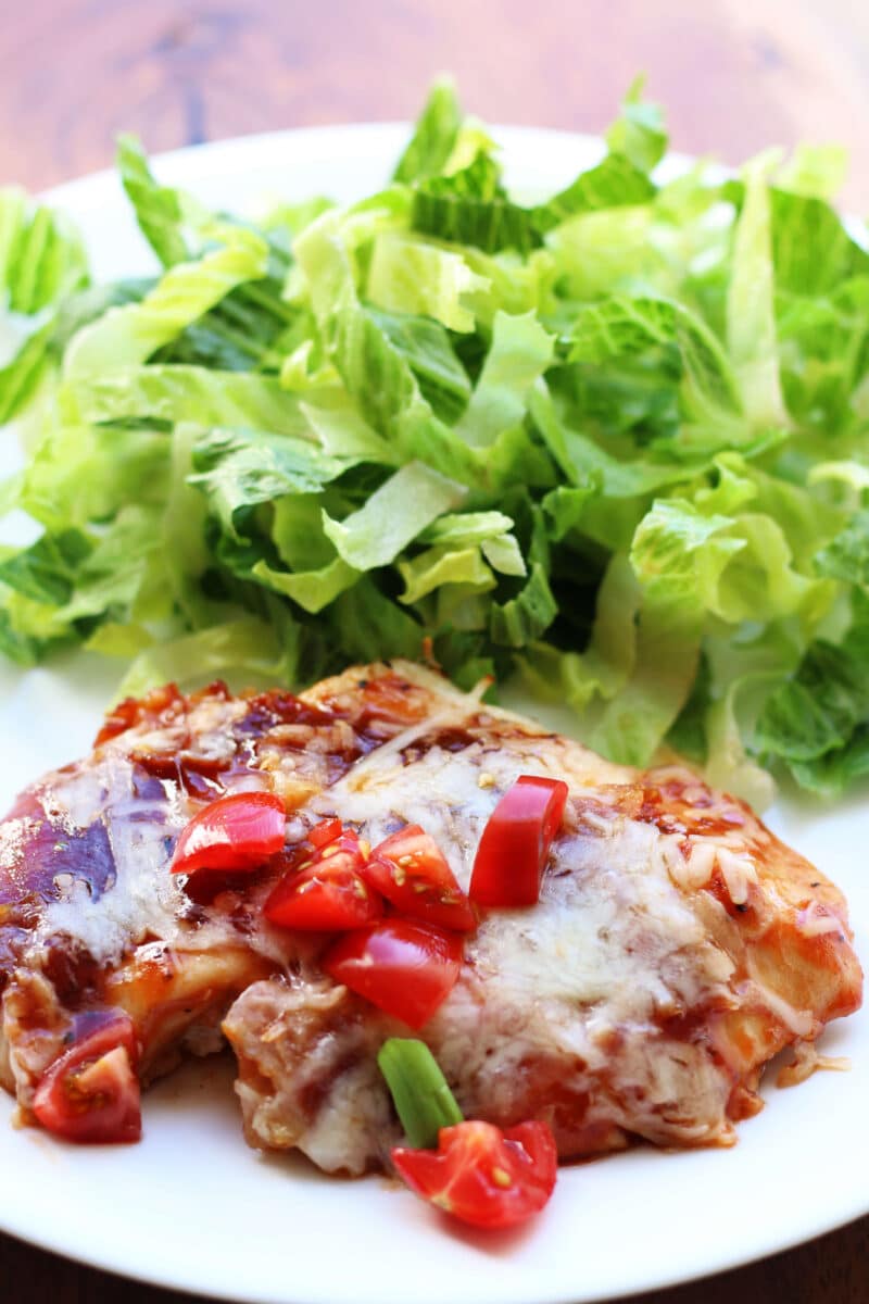 4-Ingredient Monterey Chicken Bake--an easy oven-baked chicken dinner topped with barbecue sauce, crispy bacon and melty Monterey Jack cheese. Make an extra pan for leftovers or to freeze!