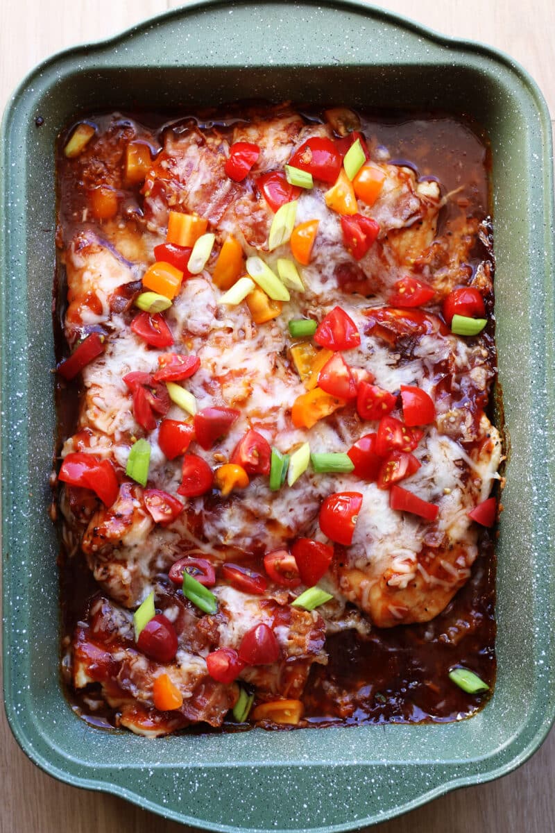 4-Ingredient Monterey Chicken Bake--an easy oven-baked chicken dinner topped with barbecue sauce, crispy bacon and melty Monterey Jack cheese. Make an extra pan for leftovers or to freeze!