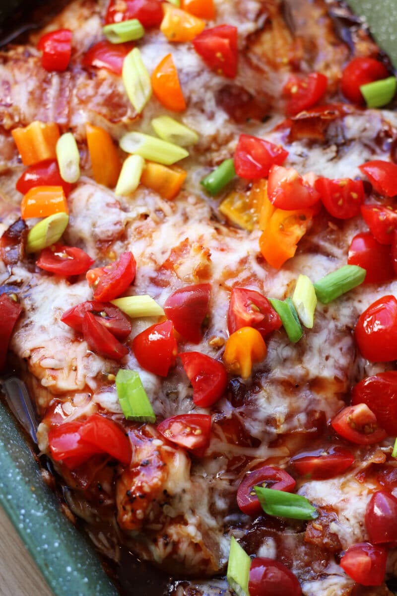 4-Ingredient Monterey Chicken Bake--an easy oven-baked chicken dinner topped with barbecue sauce, crispy bacon and melty Monterey Jack cheese. Make an extra pan for leftovers or to freeze!
