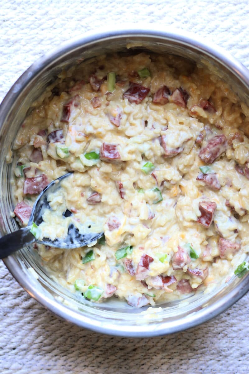 Delicious Neiman Marcus Kielbasa Casserole--an easy Instant Pot dinner made with smoky sausage, creamy rice, cheddar cheese, bacon and slivered almonds.