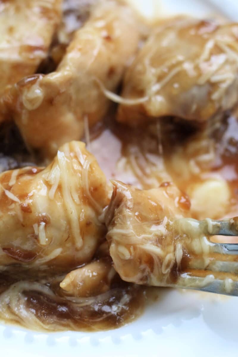French Onion Slow Cooker Dump Chicken--the easiest chicken ever! With only 4 main ingredients this dump and go crockpot chicken is fast to make and delicious to eat. 