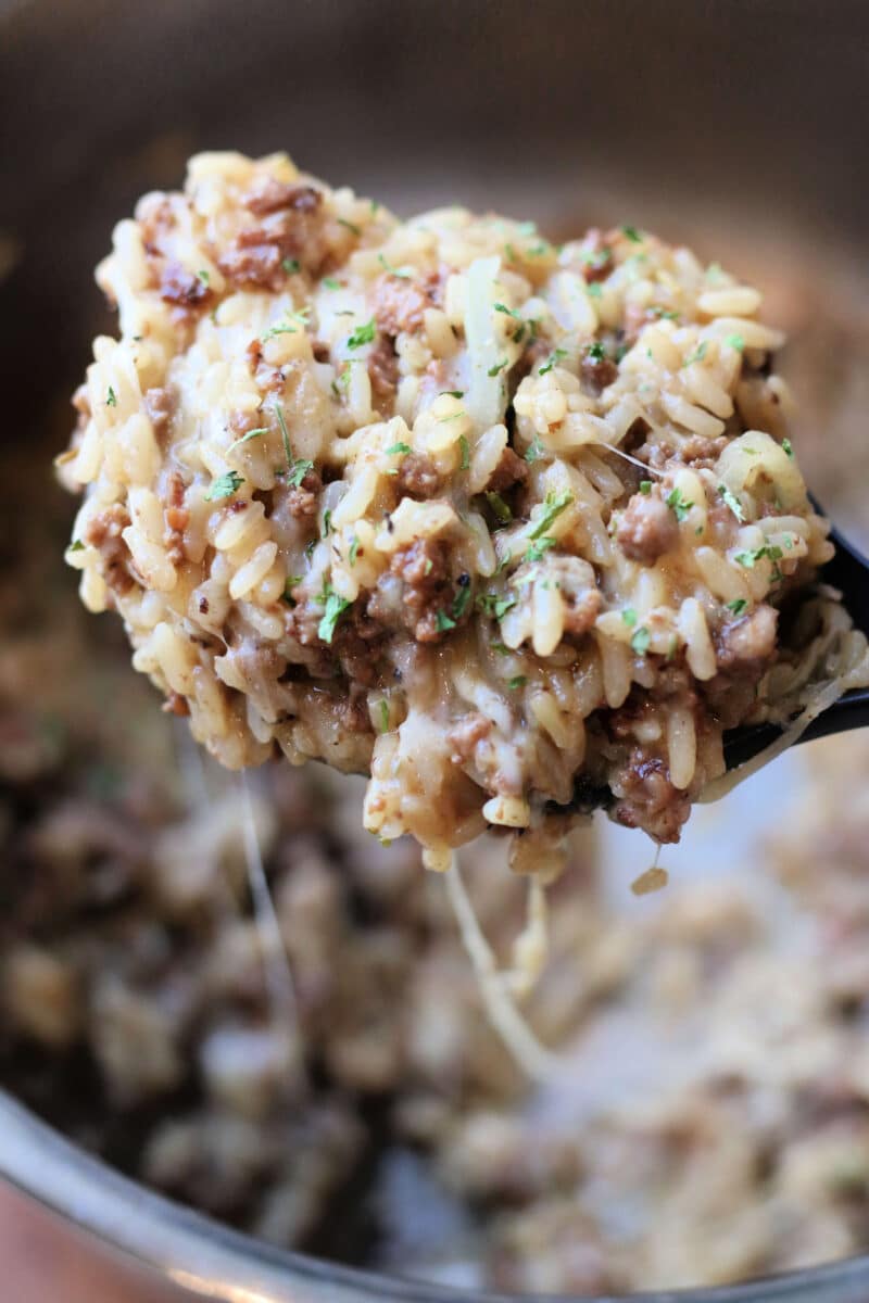 Incredible French Onion Ground Beef Casserole--an easy Instant Pot dinner made with ground beef, sliced onions, seasoned rice, melted Parmesan and mozzarella and crispy French fried onions on top.