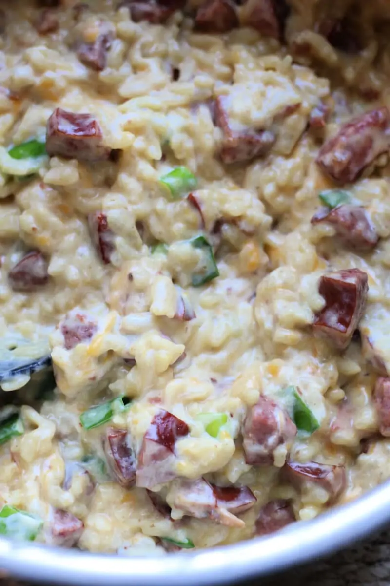 Delicious Neiman Marcus Kielbasa Casserole--an easy Instant Pot dinner made with smoky sausage, creamy rice, cheddar cheese, bacon and slivered almonds.