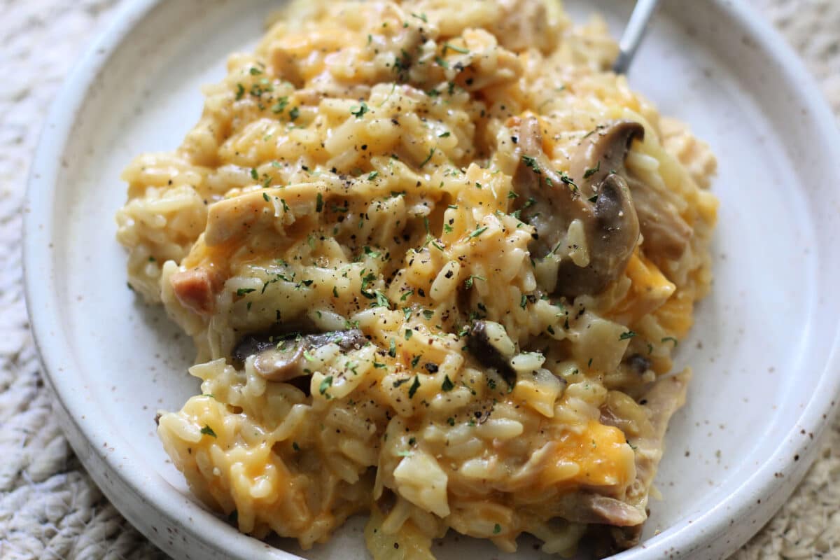 Classic Country Gentlemen's Casserole--an easy Instant Pot or slow cooker dinner made with tender chicken, rice, celery, mushrooms, crunchy water chestnuts and almonds in a creamy, cheesy sauce.