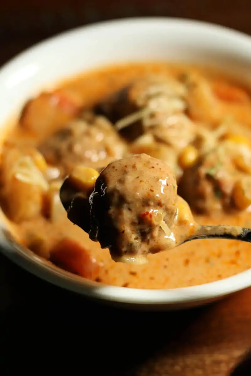 Crockpot Cheesy Italian Meatball Soup--an easy dump and go slow cooker soup made with tender meatballs, potatoes, vegetables and Parmesan cheese in a creamy, savory broth.