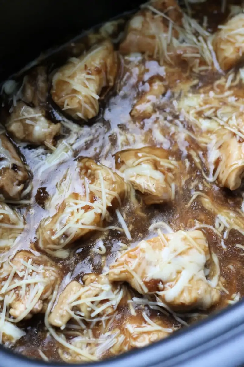 French Onion Slow Cooker Dump Chicken--the easiest chicken ever! With only 4 main ingredients this dump and go crockpot chicken is fast to make and delicious to eat. 