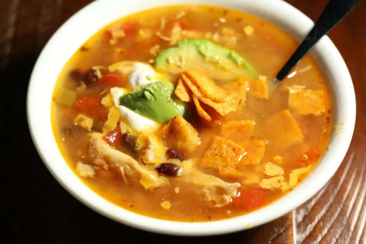 Dump and Go Chicken Taco Soup--an easy Instant Pot or slow cooker soup with tender shredded chicken, black beans, corn, tomatoes and green chiles.