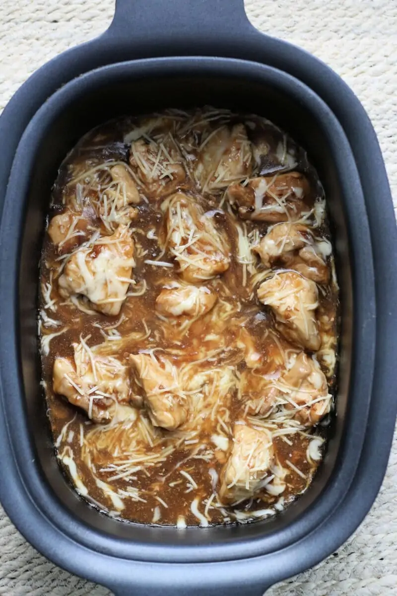 French Onion Slow Cooker Dump Chicken--the easiest chicken ever! With only 4 main ingredients this dump and go crockpot chicken is fast to make and delicious to eat. 
