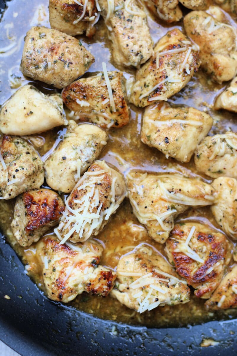 Simple Garlic Parmesan Butter Chicken--tender, juicy pieces of seasoned chicken cooked in a skillet and finished with a buttery garlic Parmesan sauce for a quick and easy dinner.