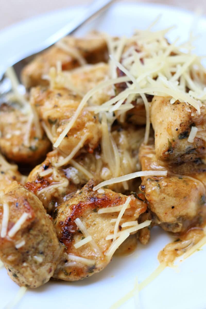Simple Garlic Parmesan Butter Chicken--tender, juicy pieces of seasoned chicken cooked in a skillet and finished with a buttery garlic Parmesan sauce for a quick and easy dinner.