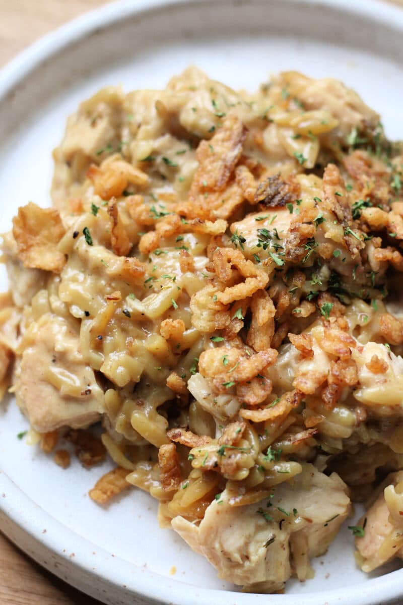 French Onion Chicken Orzo Casserole--an easy Instant Pot dinner with tender chicken and creamy orzo with savory caramelized onions, Parmesan cheese and crispy French fried onions.