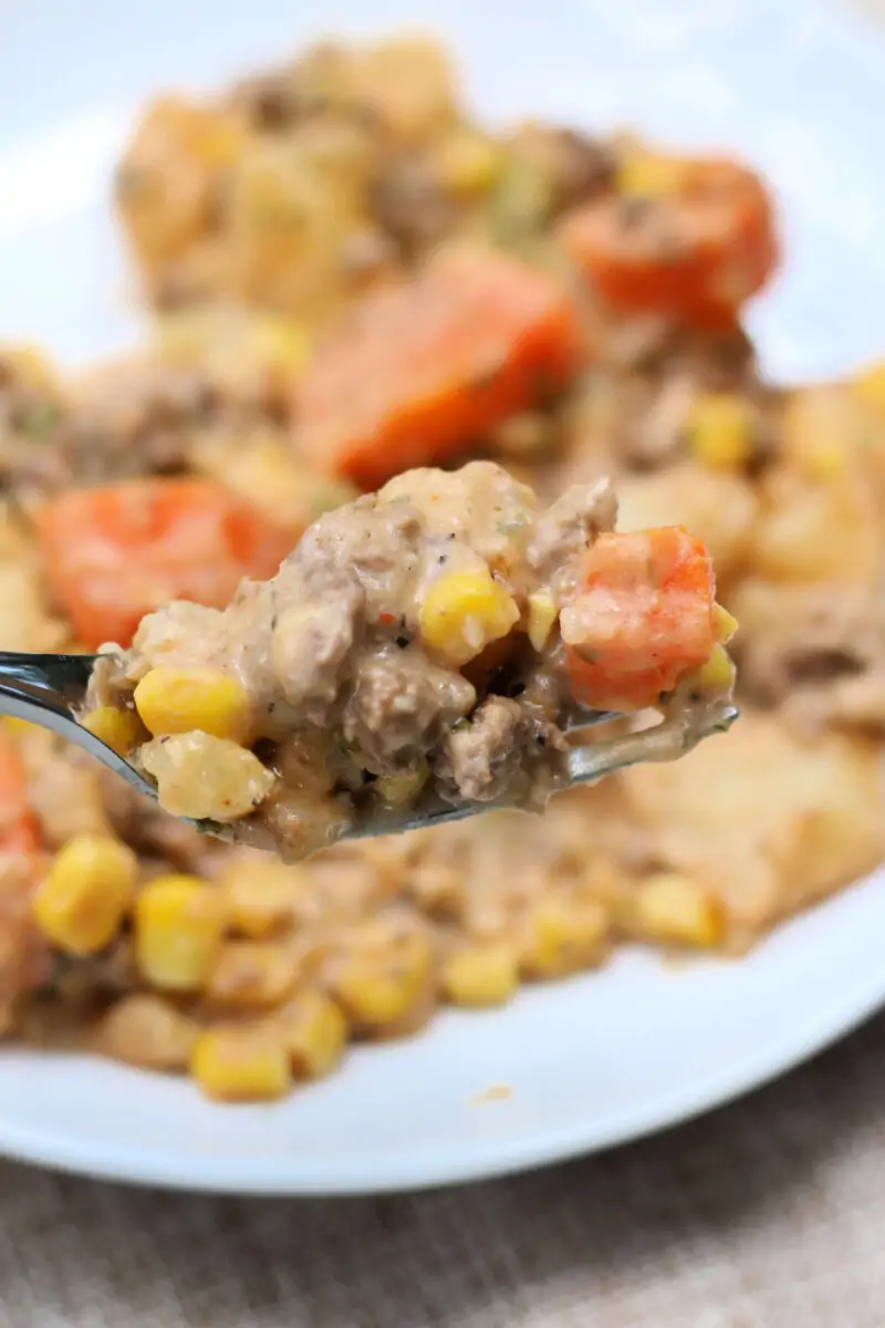 Cozy Farmhouse Beef and Potato Casserole--a cheesy beef and potato casserole that's an easy one-pot dinner made with ground beef, tender potatoes, carrots, corn and cheddar cheese in the Instant Pot or slow cooker.