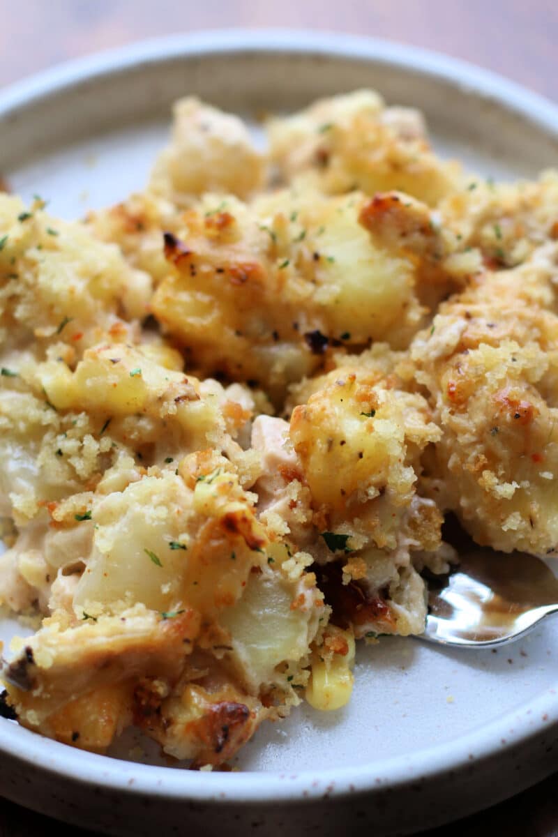 Pepper Jack Potato Casserole--a creamy, cheesy casserole made with tender potatoes, rotisserie chicken, sweet corn, pepper jack cheese and a crispy buttery panko topping.