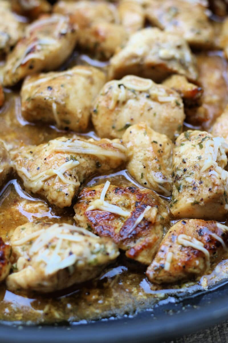 Simple Garlic Parmesan Butter Chicken--tender, juicy pieces of seasoned chicken cooked in a skillet and finished with a buttery garlic Parmesan sauce for a quick and easy dinner.