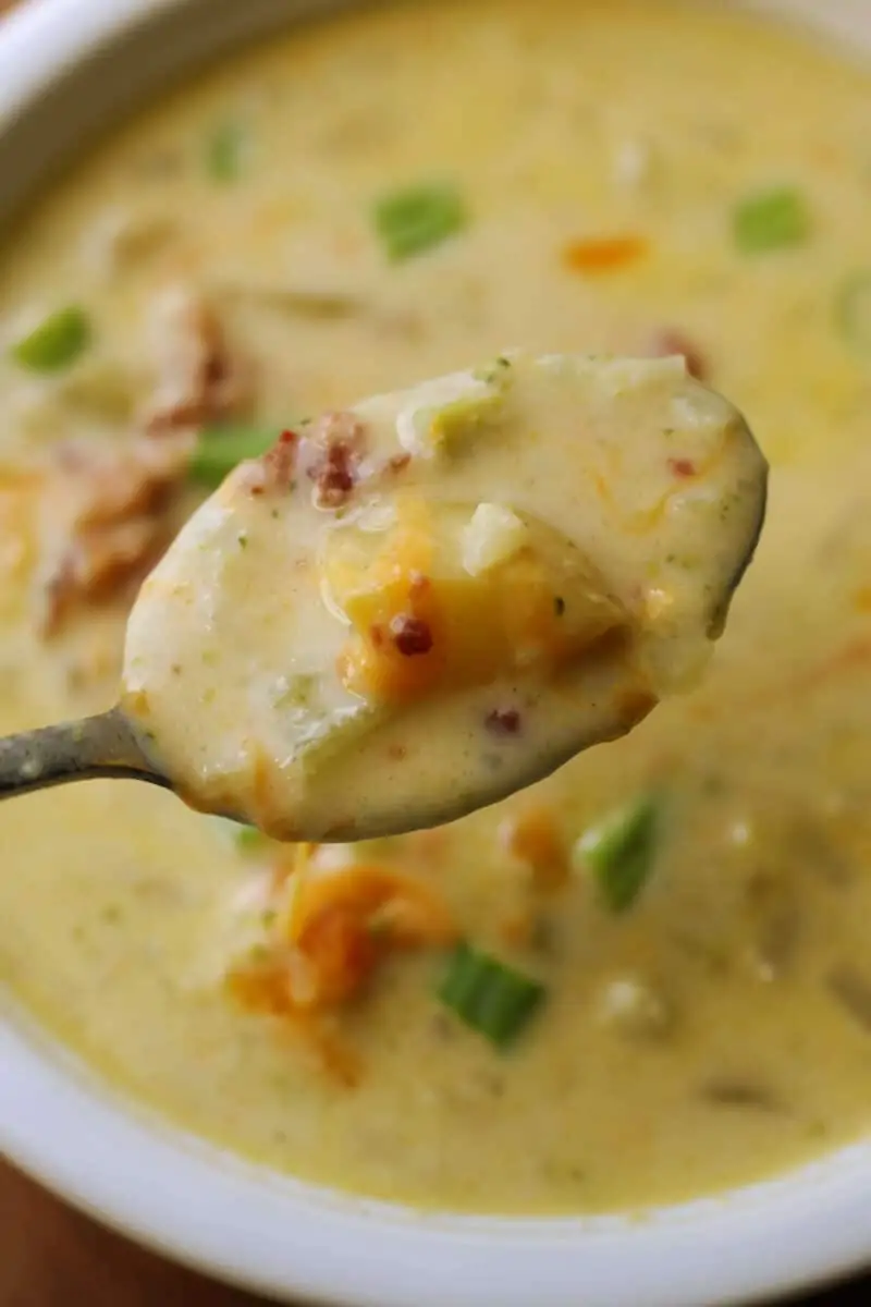 Crockpot Potato Broccoli Cheddar Soup--a dump and go creamy slow cooker (or Instant Pot) vegetable soup loaded with potatoes, broccoli, cauliflower, carrots and sharp cheddar cheese for an easy dinner.