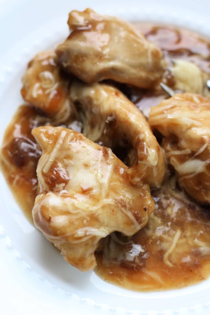 French Onion Slow Cooker Dump Chicken--the easiest chicken ever! With only 4 main ingredients this dump and go crockpot chicken is fast to make and delicious to eat. 
