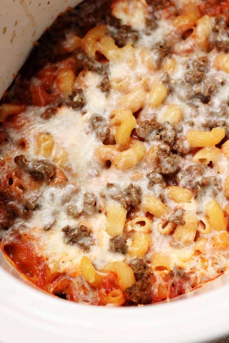 Crock Pot Million Dollar Pasta--an easy crockpot dinner made with ground beef, cavatappi pasta, spaghetti sauce and a creamy layer of cream cheese, sour cream and ricotta.