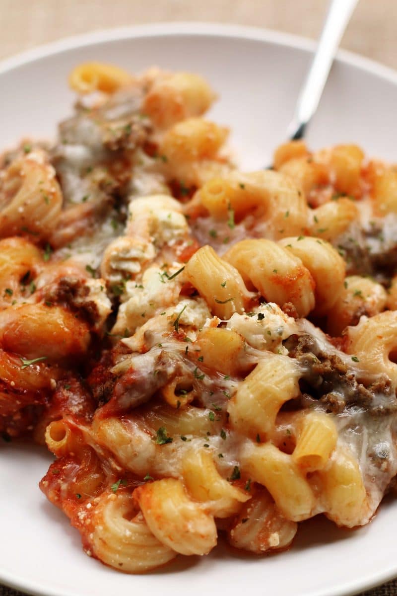 Crock Pot Million Dollar Pasta--an easy crockpot dinner made with ground beef, cavatappi pasta, spaghetti sauce and a creamy layer of cream cheese, sour cream and ricotta.